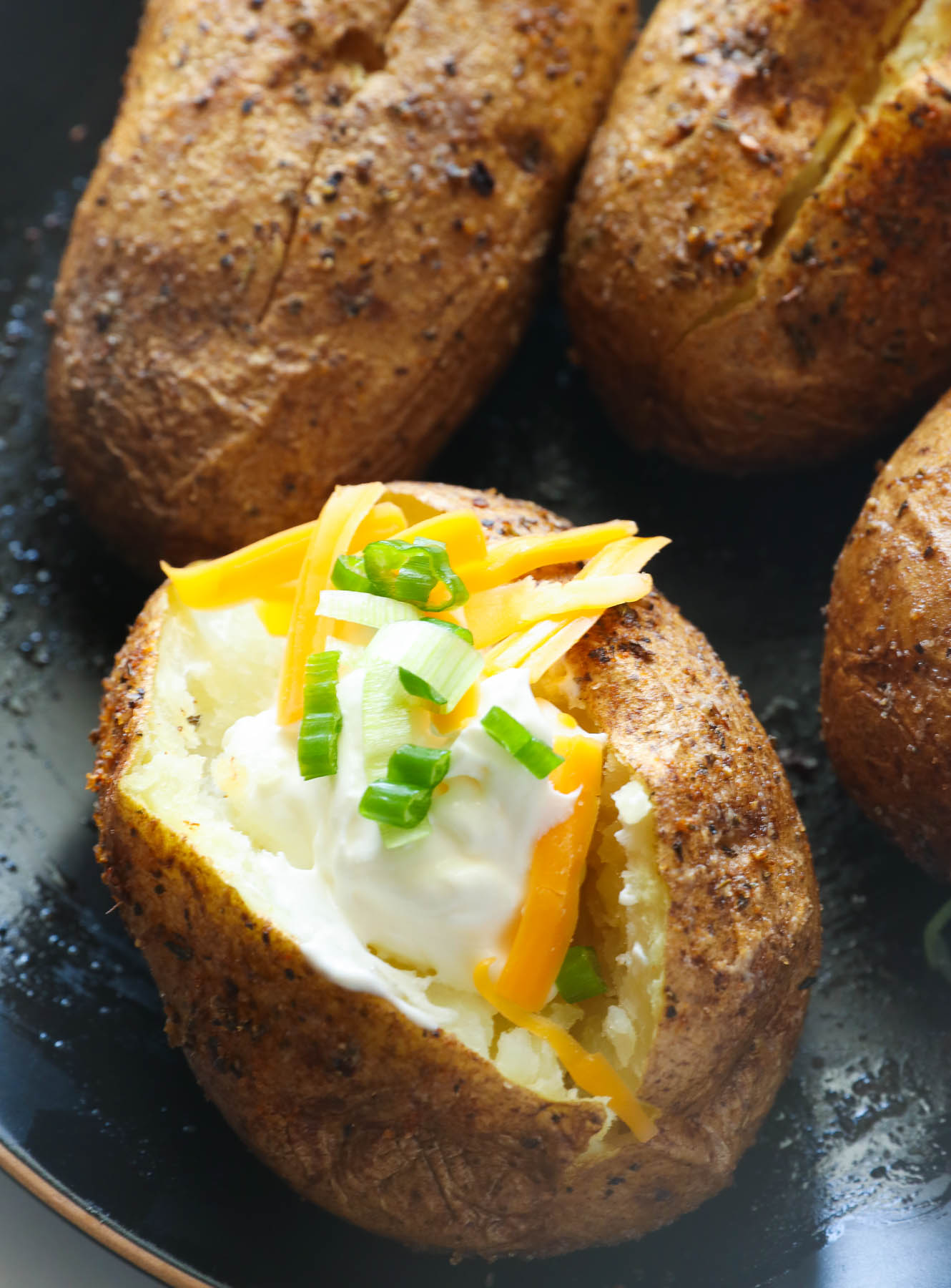 smoked bake potatoes served with toppings for added flavor