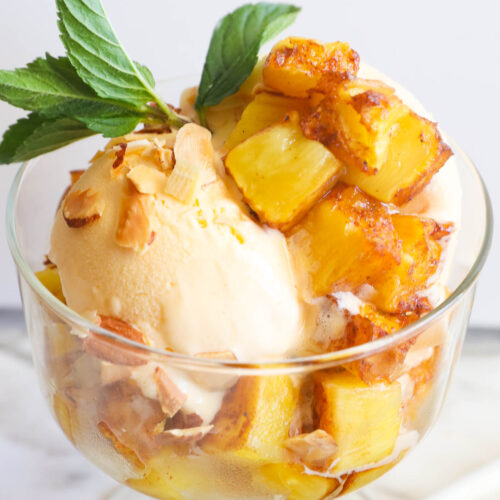 Mouthwatering smoked pineapple atop some ice cream for a dessert option