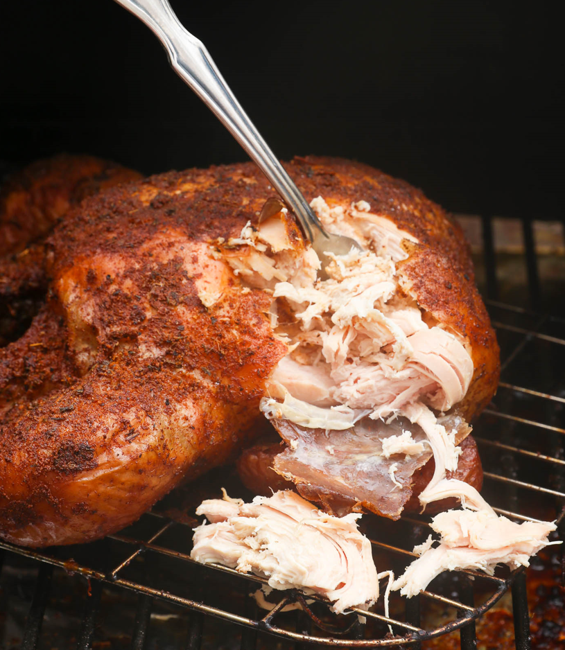Tender smoked pulled chicken, perfectly cooked and ready to be enjoyed in a variety of delicious dishes.